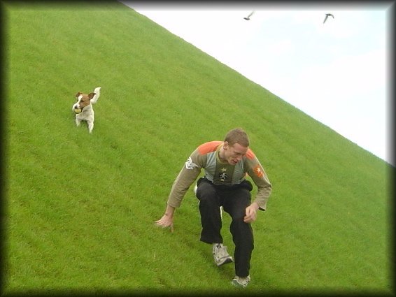 Dog chewing on ball and ericP climbing down Bercy