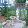 Saint Francis in a garden, next to a fountain