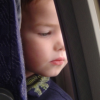 Little boy watching out the window of the San Jose - Chicago plane