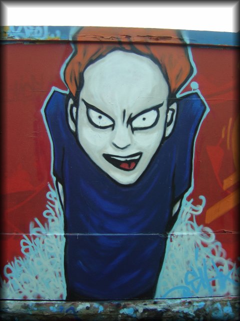 Graffiti of an angry looking pale fella