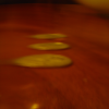 Three coins on the table and a bowl