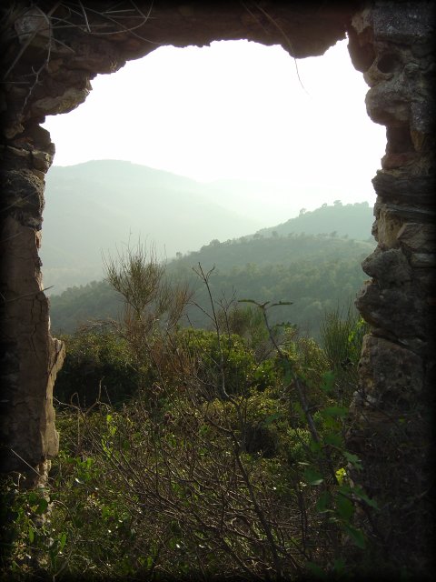 arch in the ruins and view on the mountains from Mont Peygros near Auribeau sur Siagne, FR