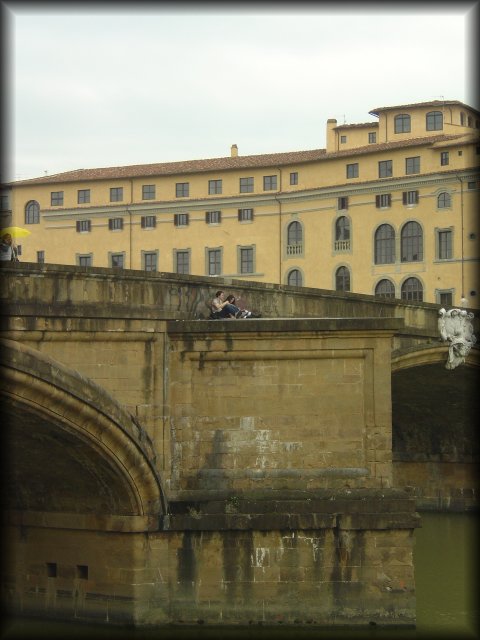 A couple found a nice place to sit on a bridge, Firenze
