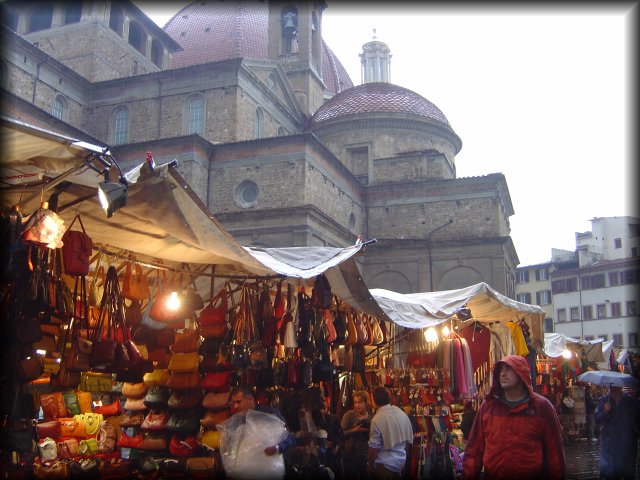 Market behind il Duomo, Firenze, warm colours under the tent and grey from the weather above