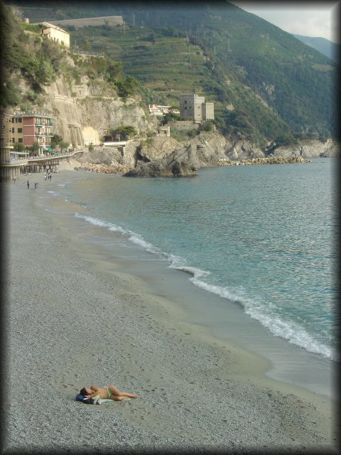 Woman alone on the beach, Monterosso al Mare, one of the cinque terre