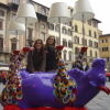 Two girls posing behind an upside down cow with lamps, Firenze