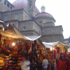 Market behind il Duomo, Firenze, warm colours under the tent and grey from the weather above