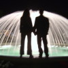ericP and I standing in front of a brightly lit fountain, Monaco