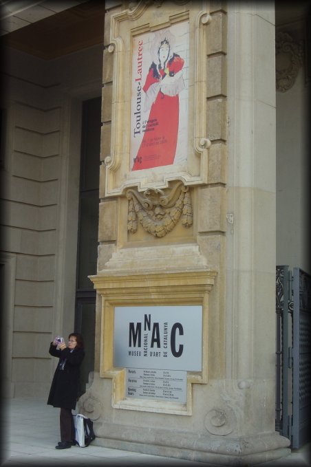 Toulouse Lautrec exposition at the Museu Nacional d'Art de Catalunya. A tourist taking a photo.