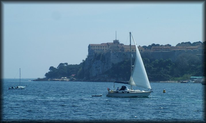 Sailing boat in front of Sainte-Marguerite island, the fort