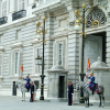Horse-mounted and standing guards at the entrance of Palacio Real