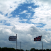 At Stansted airport between two flights. Flags against the sky.