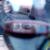 While Amy was fiddling with her camera, I was fiddling with mine, trying to capture a neat reflection of her eyes on the surface of the wine in my glass.