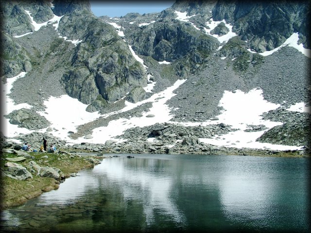 Reflection of the white of the snow in the lake.