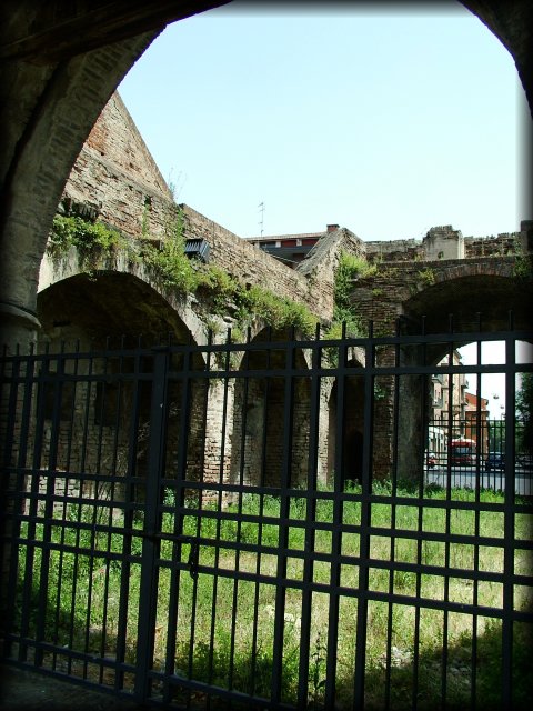 Iron gates in Porta San Donato, some wilderness in between.