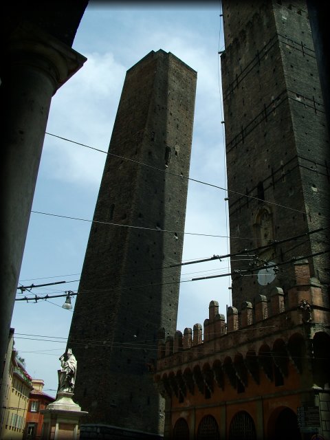 Everything is pointing toward a point far far far up. Towers from the 12th century on Piazza Ravegnana. Torre degli Asinelli is the straight one and it's 97,20 m. high. Torre Garisenda is the slanted one and it's 47 m. high.