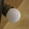 Arcades reflected in a bulb.