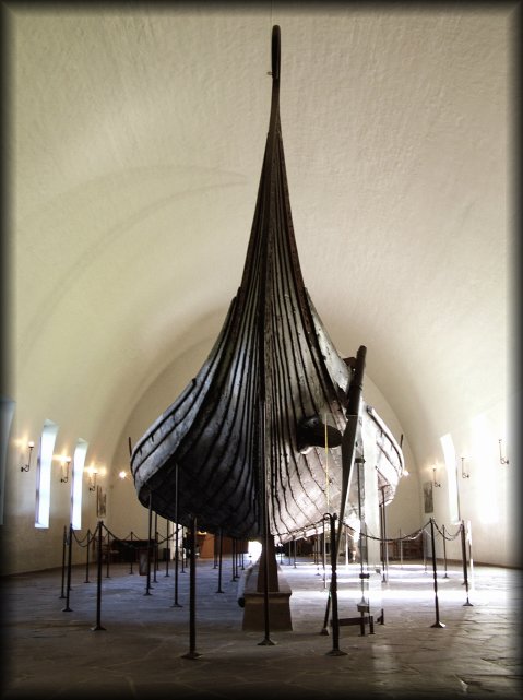 The Oseberg Ship at the Viking Ship Museum.  <em>The Oseberg Ship was found in a large burial mound at the Slagen farm in Vestfold and excavated in 1904. The ship was built in around 815-820 A.D. and had been used as a sailing vessel for many years before it was put to use as a burial ship for a prominent woman who died in 834. The ship, built of oak, was 22 meters long and 5 meters wide. The 12 strakes were secured with iron nails. The ship was designed for both rowing and sailing. With a square sail of about 90 sq. m., it could reach speeds of over 10 knots. The top strake had 15 oar holes.</em>  <em>The skeletons of two women were found in the grave. One, aged 60-70, suffered badly from arthritis and other maladies; the second was aged 25-30. It is not clear which one was the most important in life, or whether one was sacrificed to accompany the other in death. Although the high-ranking woman's identity is unknown, it has been suggested that it is the burial of Queen Asa of the Ynglinge clan, mother of Halfdan the Black and grandmother of Harald Fairhair. This theory is now generally dispelled, and it is now thought that she may have been a priestess.</em>