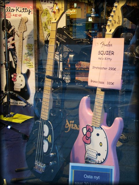 Hello Kitty! electric guitars in a shop window.