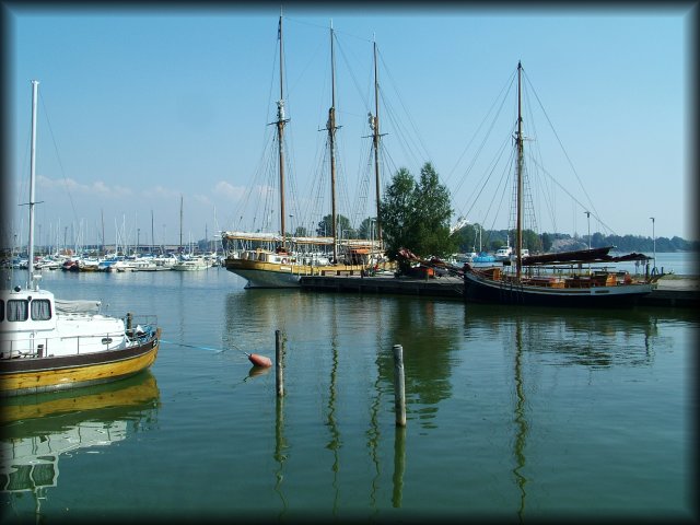 Sailboats without sails in the harbour.