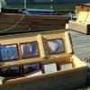Photos on display of the various stages of the restoring of the boat