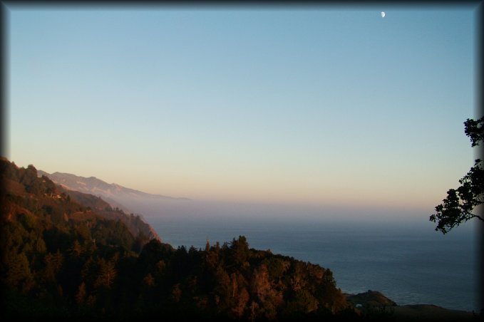 At dusk, from the terrace of the Nepenthe Caf\216, the moon reveals itself. 