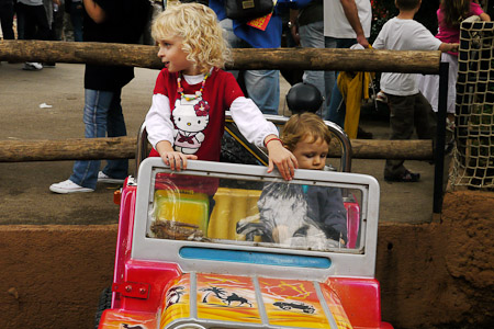 Adrien and blond girl in the jeep