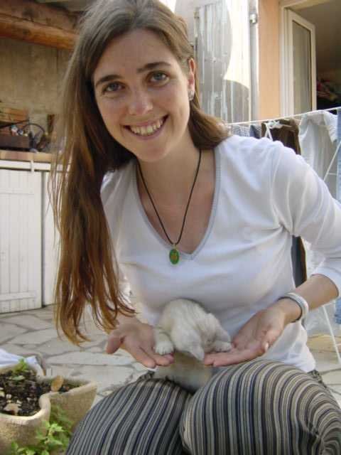 Coralie squatting, Emu on her lap