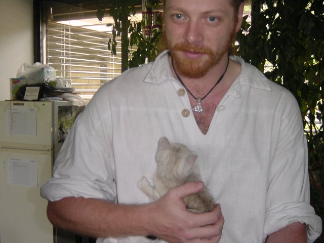Charles holding Emu in a hand