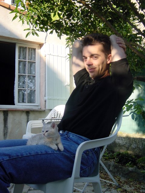 Emu on Steph's lap on the terrasse