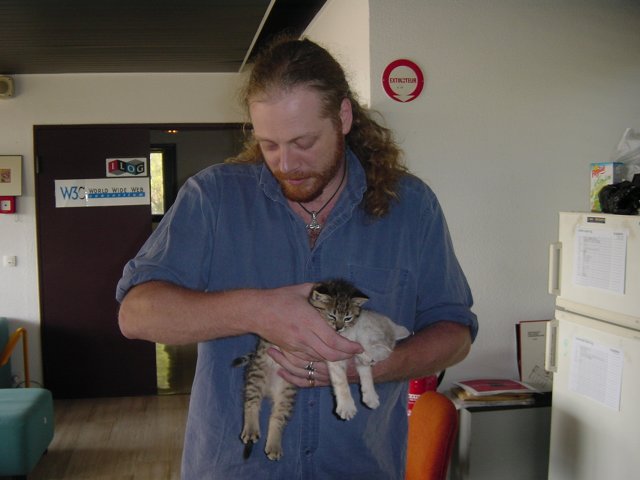 Charles squeezing Pichu and Emu in his hands