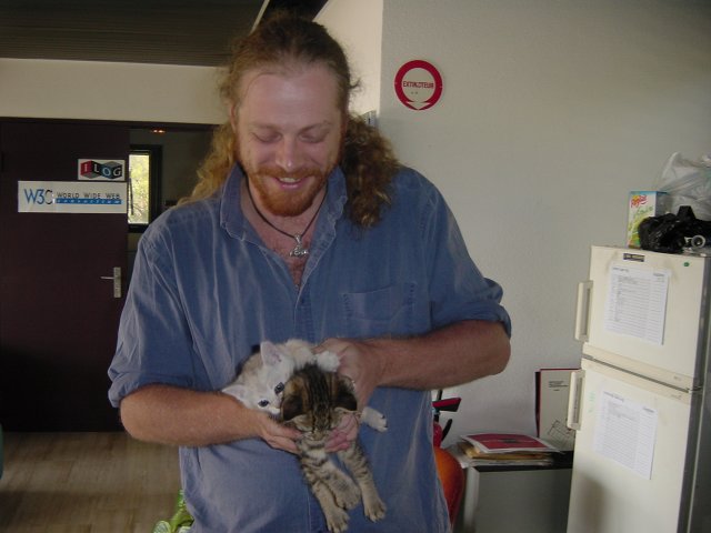 Charles squeezing Pichu and Emu in his hands