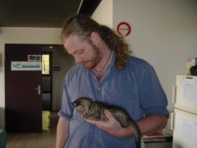 Charles holding Pichu in a hand