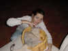 Coralie pointing a finger on Emu's head