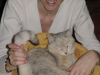 Coralie holding Emu's tail