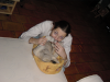 Coralie making a mustacke out of Emu's tail