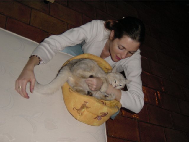 Emu biting Coralie's forearm