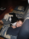 Coralie and Emu sprawled on the couch