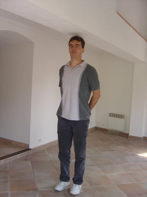 Steph standing in the living/dining room