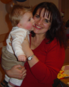 Alexis in the arms of his nanny, Sandrine
