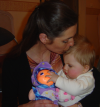 Coralie kissing Alexis' hair