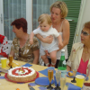 Christine and Alexis among a series of grand mothers