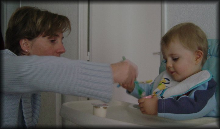Christine helps Alexis finish the yoghurt (see, there's another one in the pipe)
