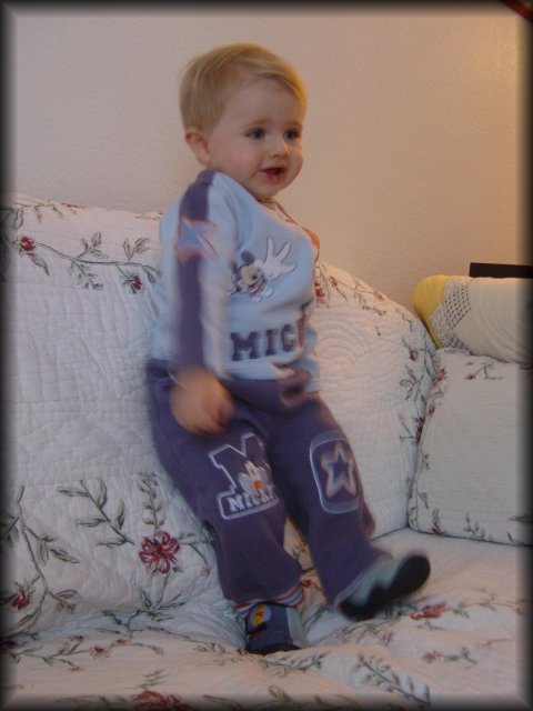 Alexis giggling on the couch (must have been something amusing on TV)