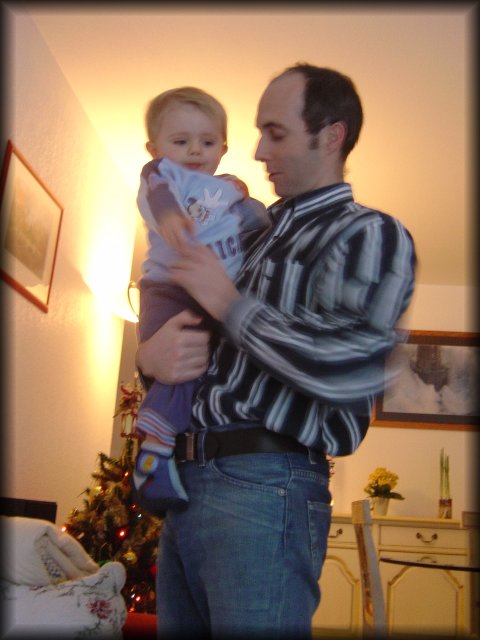 Alexis in the arms of Olivier, his father
