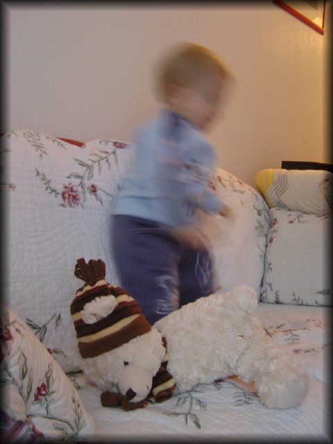More dancing on the couch, with the teddy bear not far this time