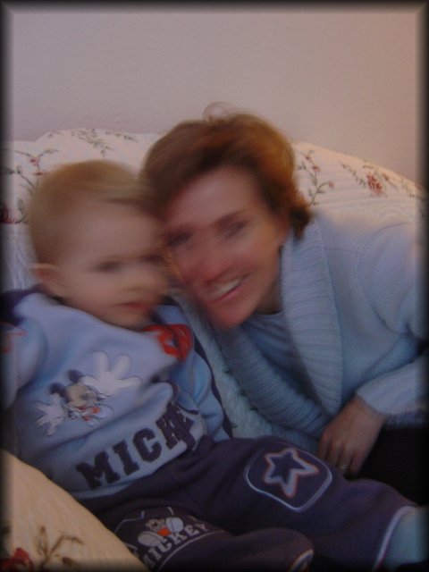 Alexis and Christine giggling on the couch