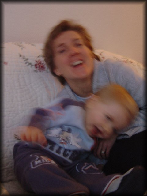 Alexis and Christine giggling on the couch