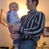 Alexis in the arms of Olivier, his father