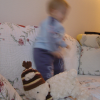 More dancing on the couch, with the teddy bear not far this time